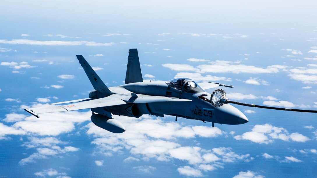 A Spanish Air Force F/A-18 Hornet with 462 Squadron receives fuel from a U.S. Marine Corps KC-130J with Marine Aerial Refueler Transport Squadron 252, Special-Purpose Marine Air-Ground Task Force-Crisis Response- Africa during an aerial refuel mission, Gran Canaria, Spain, Mar. 29, 2016. SPMAGTF-CR-AF Marines and Spanish airmen conducted air-to-air refueling missions in order to enhance crisis response readiness and help build relationships between the two militaries. 