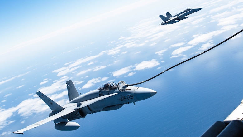 Spanish Air Force F/A-18 Hornet with 462 Squadron receive fuel from a U.S. Marine Corps KC-130J with Marine Aerial Refueler Transport Squadron 252, Special-Purpose Marine Air-Ground Task Force-Crisis Response- Africa during an aerial refuel mission, Gran Canaria, Spain, Mar. 29, 2016. SPMAGTF-CR-AF Marines and Spanish airmen conducted air-to-air refueling missions in order to enhance crisis response readiness and help build relationships between the two militaries. 