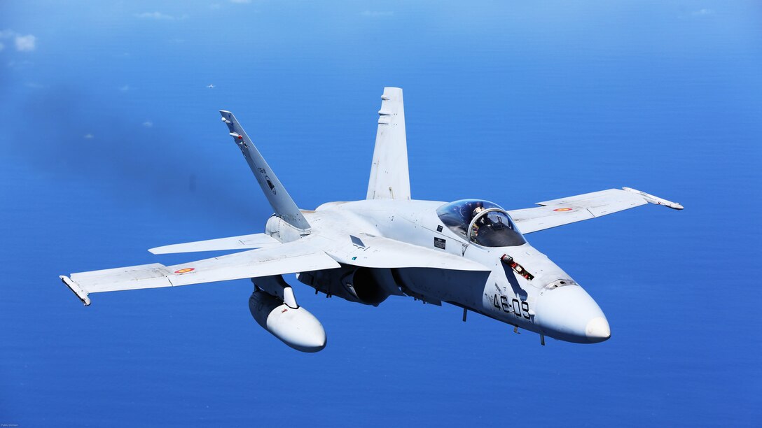A Spanish Air Force F/A-18 Hornet with 462 Squadron breaks off after receiving fuel from a U.S. Marine Corps KC-130J with Marine Aerial Refueler Transport Squadron 252, Special-Purpose Marine Air-Ground Task Force-Crisis Response- Africa during an aerial refuel mission, Gran Canaria, Spain, Mar. 29, 2016. SPMAGTF-CR-AF Marines and Spanish airmen conducted air-to-air refueling missions in order to enhance crisis response readiness and help build relationships between the two militaries.