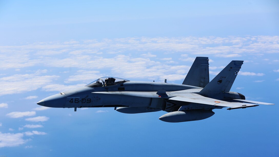 A Spanish Air Force F/A-18 Hornet with 462 Squadron breaks off after receiving fuel from a U.S. Marine Corps KC-130J with Marine Aerial Refueler Transport Squadron 252, Special-Purpose Marine Air-Ground Task Force-Crisis Response- Africa during an aerial refuel mission, Gran Canaria, Spain, Mar. 29, 2016. SPMAGTF-CR-AF Marines and Spanish airmen conducted air-to-air refueling missions in order to enhance crisis response readiness and help build relationships between the two militaries. 