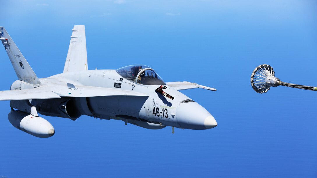 A Spanish Air Force F/A-18 Hornet with 462 Squadron prepares to receive fuel from a U.S. Marine Corps KC-130J with Marine Aerial Refueler Transport Squadron 252, Special-Purpose Marine Air-Ground Task Force-Crisis Response- Africa during an aerial refuel mission, Gran Canaria, Spain, Mar. 29, 2016. SPMAGTF-CR-AF Marines and Spanish airmen conducted air-to-air refueling missions in order to enhance crisis response readiness and help build relationships between the two militaries. 