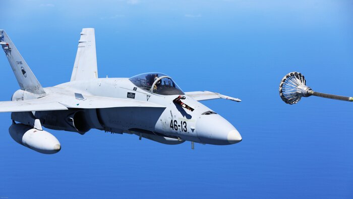 A Spanish Air Force F/A-18 Hornet with 462 Squadron prepares to receive fuel from a U.S. Marine Corps KC-130J with Marine Aerial Refueler Transport Squadron 252, Special-Purpose Marine Air-Ground Task Force-Crisis Response- Africa during an aerial refuel mission, Gran Canaria, Spain, Mar. 29, 2016. SPMAGTF-CR-AF Marines and Spanish airmen conducted air-to-air refueling missions in order to enhance crisis response readiness and help build relationships between the two militaries. 