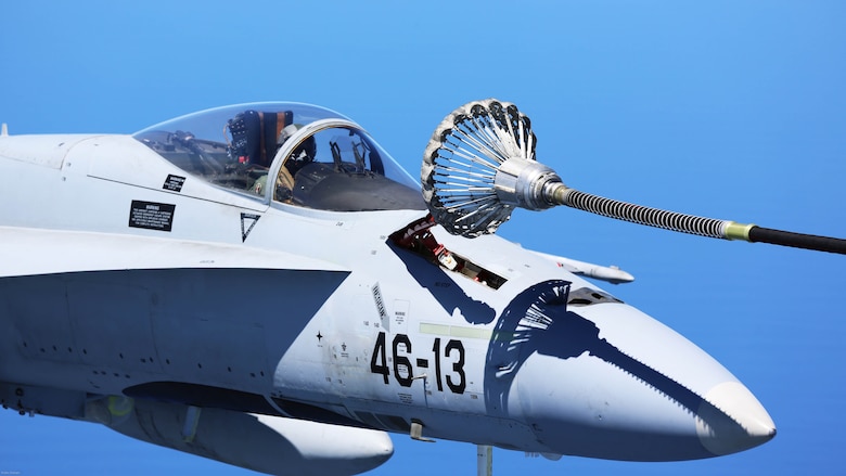 A Spanish Air Force F/A-18 Hornet with 462 Squadron receives fuel from a U.S. Marine Corps KC-130J with Marine Aerial Refueler Transport Squadron 252, Special-Purpose Marine Air-Ground Task Force-Crisis Response- Africa during an aerial refuel mission, Gran Canaria, Spain, Mar. 29, 2016. SPMAGTF-CR-AF Marines and Spanish airmen conducted air-to-air refueling missions in order to enhance crisis response readiness and help build relationships between the two militaries. 