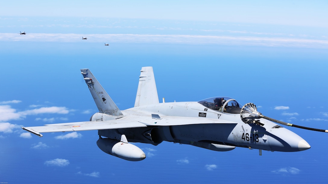 A Spanish Air Force F/A-18 Hornet with 462 Squadron refuels during an air-to-air refuel mission with a U.S. Marine Corps KC-130J with Marine Aerial Refueler Transport Squadron 252, Special-Purpose Marine Air-Ground Task Force-Crisis Response- Africa, Gran Canaria, Spain, Mar. 29, 2016. SPMAGTF-CR-AF Marines and Spanish airmen conducted air-to-air refueling missions in order to enhance crisis response readiness and help build relationships between the two militaries. 