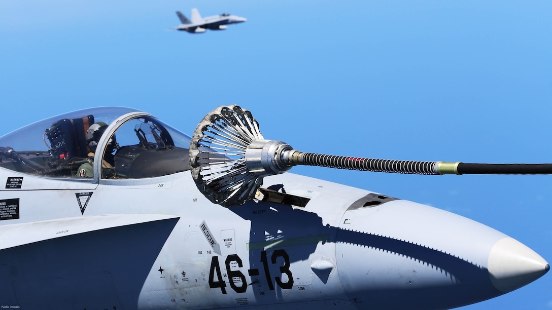 Spanish Air Force F/A-18 Hornets with 462 Squadron maintain formation during an air-to-air refuel mission with a U.S. Marine Corps KC-130J with Marine Aerial Refueler Transport Squadron 252, Special-Purpose Marine Air-Ground Task Force-Crisis Response- Africa, Gran Canaria, Spain, Mar. 29, 2016. SPMAGTF-CR-AF Marines and Spanish airmen conducted air-to-air refueling missions in order to enhance crisis response readiness and help build relationships between the two militaries. 