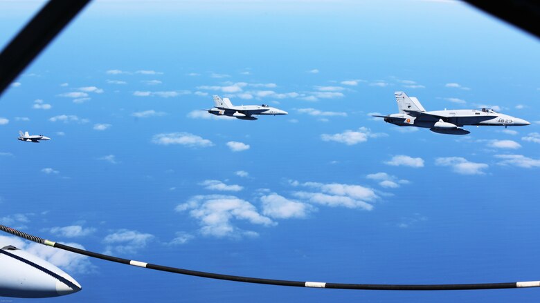 Spanish Air Force F/A-18 Hornets with 462 Squadron wait to be refueled during an air-to-air refuel mission with a U.S. Marine Corps KC-130J with Marine Aerial Refueler Transport Squadron 252, Special-Purpose Marine Air-Ground Task Force-Crisis Response- Africa, Gran Canaria, Spain, Mar. 29, 2016. SPMAGTF-CR-AF Marines and Spanish airmen conducted air-to-air refueling missions in order to enhance crisis response readiness and help build relationships between the two militaries. 