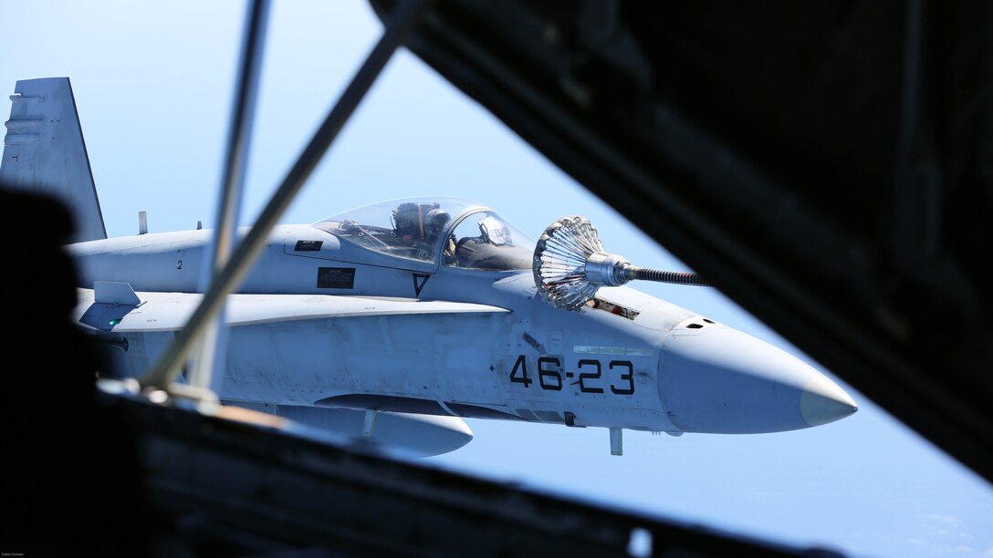 A Spanish Air Force F/A-18 Hornet with 462 Squadron receives fuel from a U.S. Marine Corps KC-130J with Marine Aerial Refueler Transport Squadron 252, Special-Purpose Marine Air-Ground Task Force-Crisis Response- Africa during an aerial refuel mission, Gran Canaria, Spain, Mar. 29, 2016. SPMAGTF-CR-AF Marines and Spanish airmen conducted air-to-air refueling missions in order to enhance crisis response readiness and help build relationships between the two militaries. 