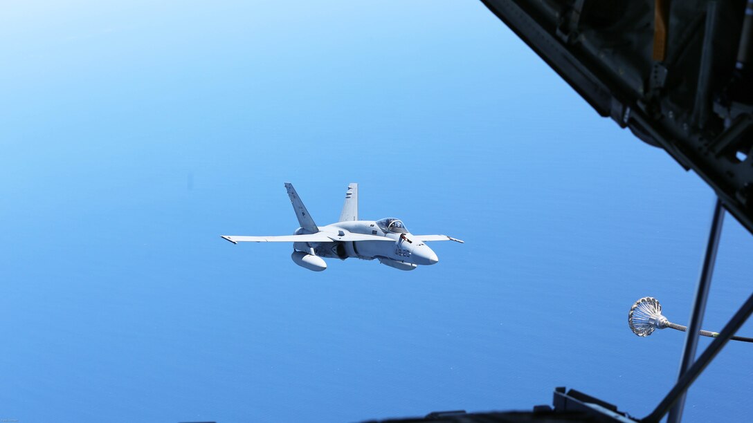 A Spanish Air Force F/A-18 Hornet with 462 Squadron prepares to receive fuel during an air-to-air refuel mission with a U.S. Marine Corps KC-130J with Marine Aerial Refueler Transport Squadron 252, Special-Purpose Marine Air-Ground Task Force-Crisis Response- Africa, Gran Canaria, Spain, Mar. 29, 2016. SPMAGTF-CR-AF Marines and Spanish airmen conducted air-to-air refueling missions in order to enhance crisis response readiness and help build relationships between the two militaries. 