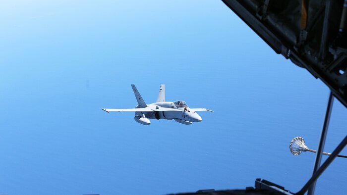 A Spanish Air Force F/A-18 Hornet with 462 Squadron prepares to receive fuel during an air-to-air refuel mission with a U.S. Marine Corps KC-130J with Marine Aerial Refueler Transport Squadron 252, Special-Purpose Marine Air-Ground Task Force-Crisis Response- Africa, Gran Canaria, Spain, Mar. 29, 2016. SPMAGTF-CR-AF Marines and Spanish airmen conducted air-to-air refueling missions in order to enhance crisis response readiness and help build relationships between the two militaries. 