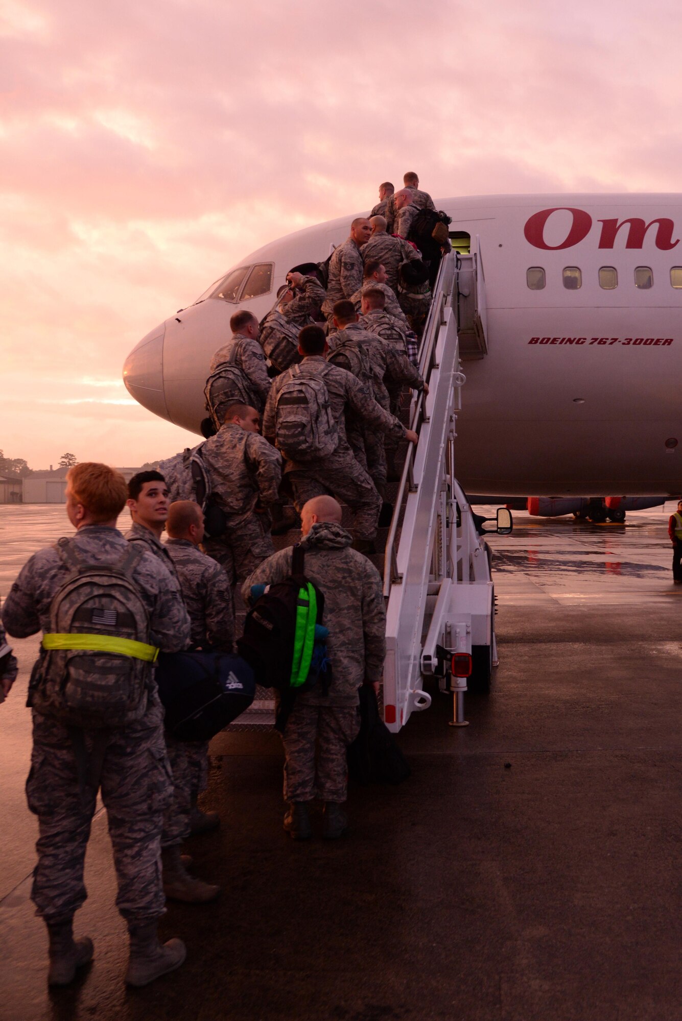 Airmen from the 4th Fighter Wing board a plane April 12, 2016, at Seymour Johnson Air Force Base, North Carolina. The Airmen deployed to Southwest Asia to support contingency operations. (U.S. Air Force photo/Staff Sgt. Chuck Broadway)