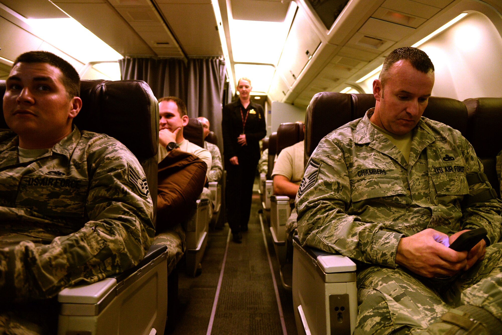 Senior Master Sgt. Jeremy Chambers, 4th Aircraft Maintenance Squadron, right, and members of the 4th AMXS, await departure April 12, 2016, at Seymour Johnson Air Force Base, North Carolina. Airmen from Seymour Johnson AFB deployed to Southwest Asia to conduct missions in support of combatant commanders. (U.S. Air Force photo/Staff Sgt. Chuck Broadway)