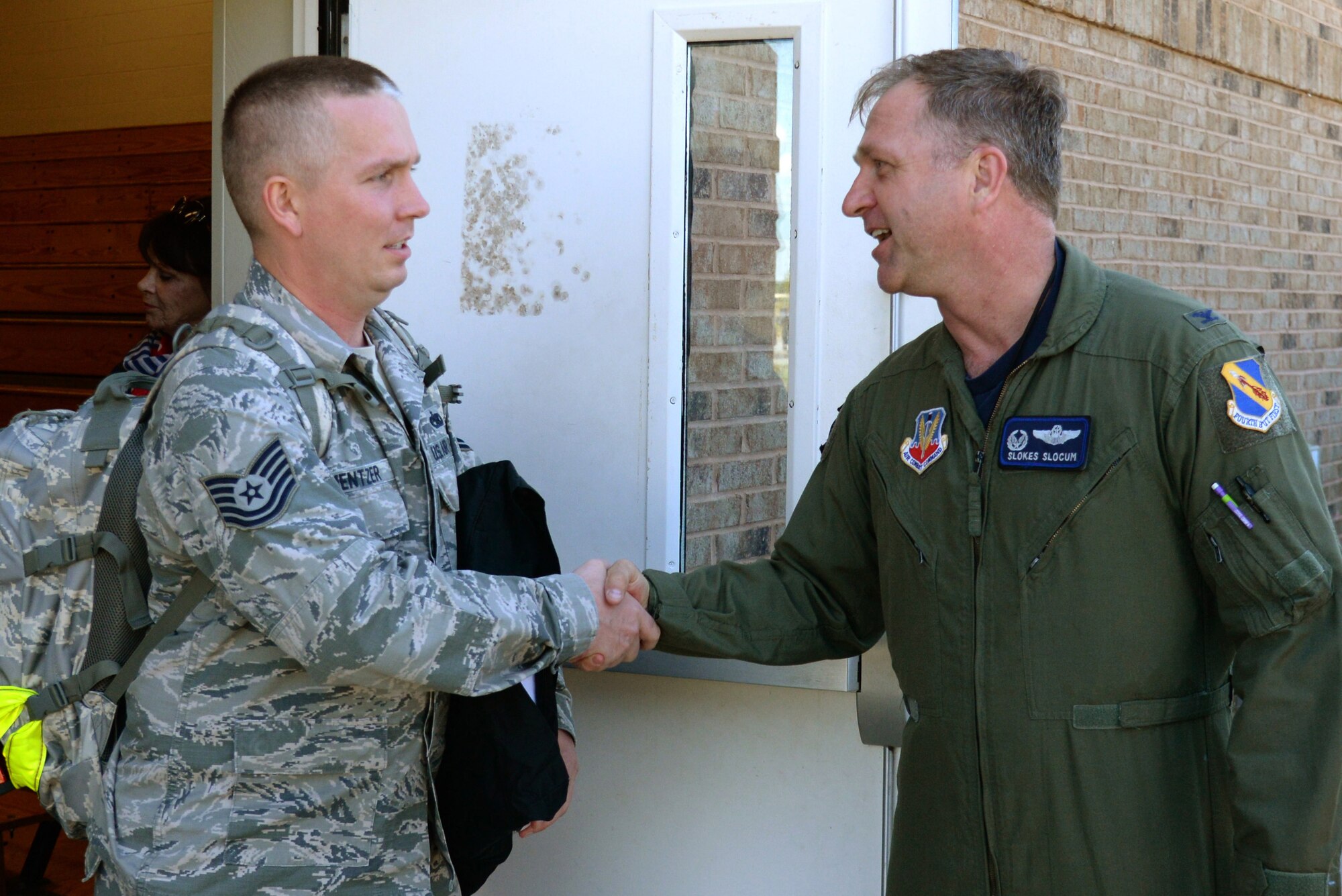 Col. Mark Slocum, 4th Fighter Wing commander, thanks a 4th Maintenance Group member as he prepares to deploy, April 10, 2016, at Seymour Johnson Air Force Base, North Carolina. Aircraft and support personnel deployed to Southwest Asia to meet combatant commander objectives. (U.S. Air Force photo/Staff Sgt. Chuck Broadway)