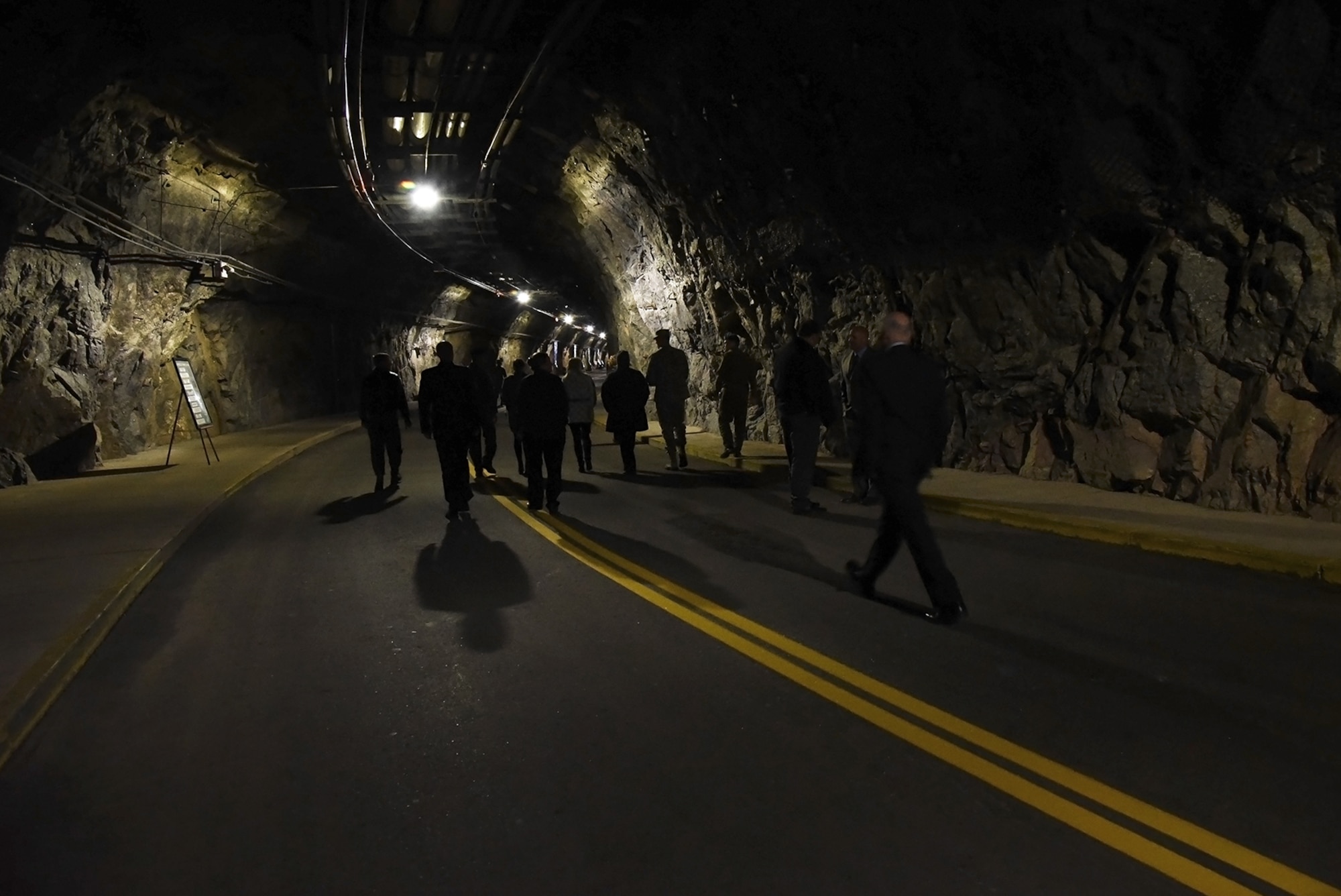 Attendees of the 50th anniversary rededication ceremony tour the north portal tunnel at Cheyenne Mountain Air Force Station, Colo., April 15, 2016. Since its inception during the Cold War and throughout the war on terrorism, Cheyenne Mountain has remained critical to the defense mission, providing command and control for the nation since 1966. Cheyenne Mountain AFS is owned by the 21st Space Wing at Peterson Air Force Base, Colo., and operated by the 721st Mission Support Group. (U.S. Air Force photo/Airman 1st Class Dennis Hoffman)