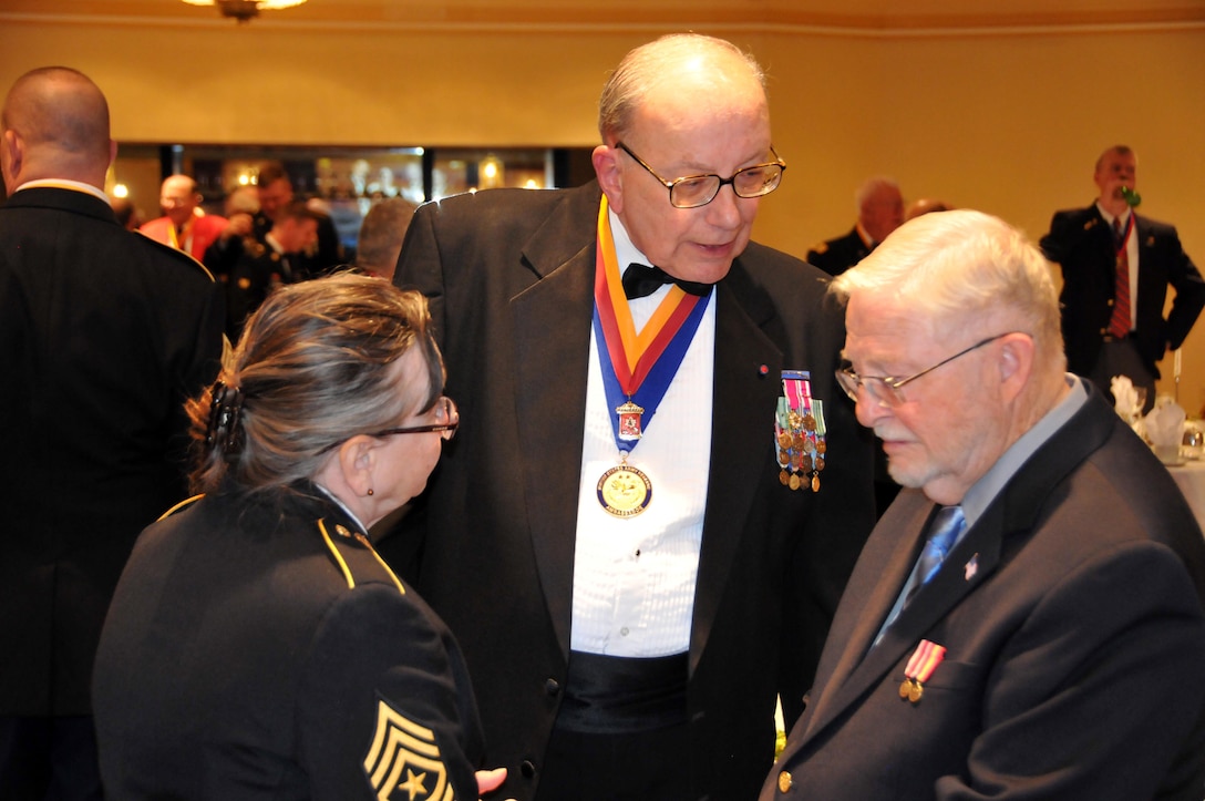 The Honorable George Duell, U.S. Army Reserve ambassador to Pennsylvania, meets with others in attendance prior to the Allentown Chapter of the Honorary First Defenders dining-in April 15 in Bethlehem, Pennsylvania. Sgt. Maj. of the Army Daniel Dailey was the guest of honor at the event.