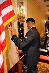 Spc. Trevon Cheese, assigned to the U.S. Army Reserve's 744th Military Police Battalion, posts the U.S. Flag at the start of the Allentown Chapter of the Honorary First Defenders dining-in April 15 in Bethlehem, Pennsylvania. Sgt. Maj. of the Army Daniel Dailey was the guest of honor at the event.