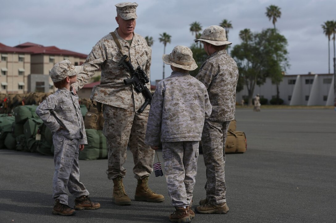 MARINE CORPS BASE CAMP PENDLETON, Calif. – Col. Kenneth R. Kassner, commanding officer of the Special Purpose Marine Air-Ground Task Force - Crisis Response - Central Command 16.2, shares a moment with his sons before departing Camp Pendleton April 14, 2016. SPMAGTF-CR-CC is a rotational contingent of approximately 2,300 Marines and sailors sourced from units throughout I Marine Expeditionary Force. The unit serves as the Marine Corps’ land-based, expeditionary crisis and contingency force in U.S. Central Command. (U.S. Marine Corps photo by Cpl. Angel Serna/Released)