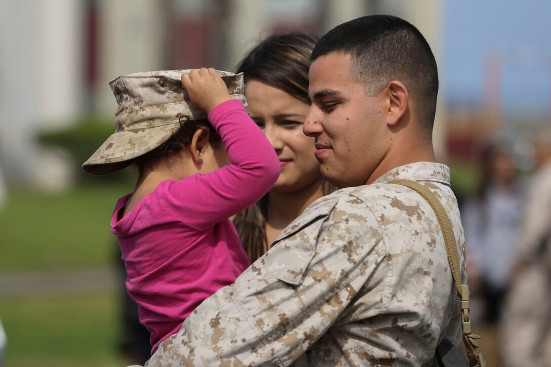 MARINE CORPS BASE CAMP PENDLETON, Calif. – Sgt. Francisco Cardenas, an administration noncommissioned officer in charge with the Special Purpose Marine Air-Ground Task Force - Crisis Response - Central Command 16.2, shares a moment with his wife and daughter before departing Camp Pendleton April 14, 2016. SPMAGTF-CR-CC is a rotational contingent of approximately 2,300 Marines and sailors sourced from units throughout I Marine Expeditionary Force. The unit serves as the Marine Corps’ land-based, expeditionary crisis and contingency force in U.S. Central Command. (U.S. Marine Corps photo by Cpl. Angel Serna/Released)