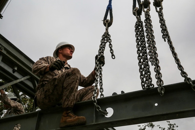MARINE CORPS BASE CAMP PENDLETON, Calif. - Sgt. Chris Piette secures a transom of a Bailey bridge on Camp Talega at Camp Pendleton April 13, 2016. Piette is a combat engineer with 7th Engineer Support Battalion, I Marine Logistics Group, and is a De Pere, Wisconsin native. The bridge provides mobility during times of flooding and severe rain. (U.S. Marine Corps photo by Lance Cpl. Shellie Hall/Released)