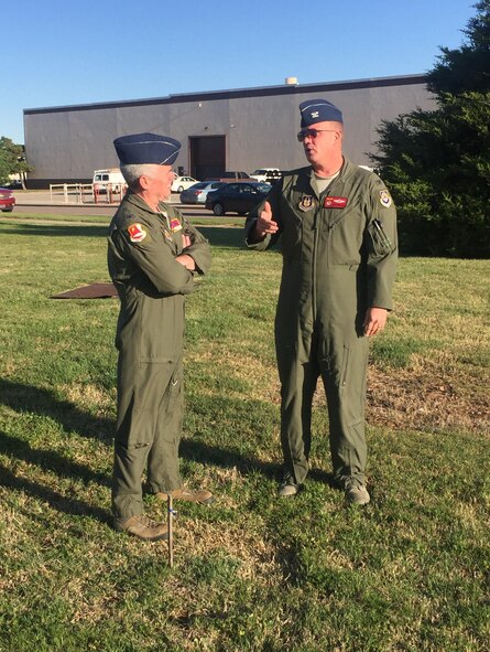 Col. John Trnka, former 513th Air Control Group commander and Col. David Robertson,  513th ACG current commander discuss the new 513th ACG operations facility at the site of the ground breaking.  Col. Trnka initial worked to get the 513th ACG building prioritized ten years ago. (Courtesy photo)   