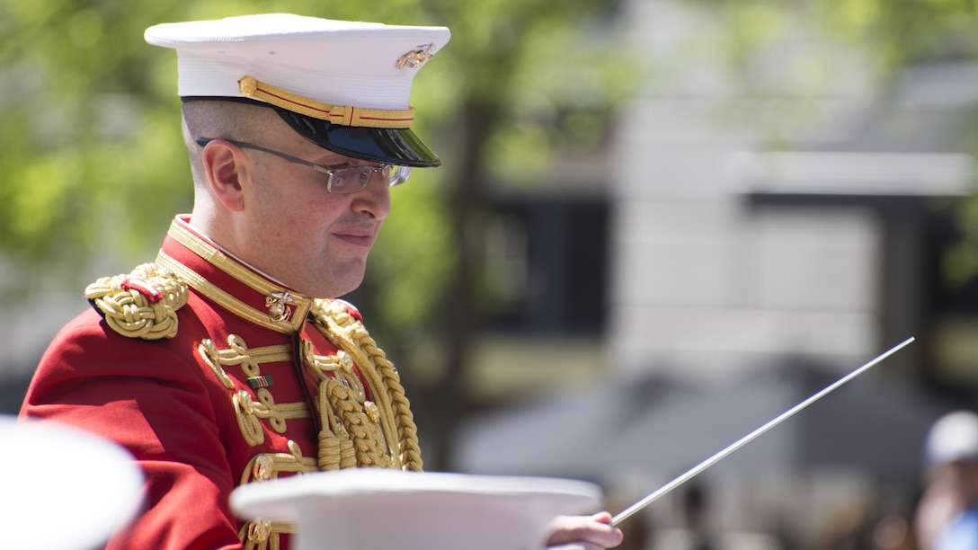 1st Lt. Ryan J. Nowlin conducts The President’s Own U.S. Marine Corps Band during the 25th annual Blessing of the Fleets ceremony at U.S. Navy Memorial in Washington, April 16. The Blessing of the Fleets ritual is intended to safeguard crews and ships from the danger of the seas through a blessing given by a clergyman at the water’s edge. During the ceremony, sailors from the U.S. Navy’s Ceremonial Guard and Marines from the U.S. Marine Barracks, Washington, DC, proceeded across the outdoor plaza’s “Granite Sea” and poured water from the Seven Seas and Great Lakes into the surrounding fountains, “charging” them to life and welcoming the spring season. 