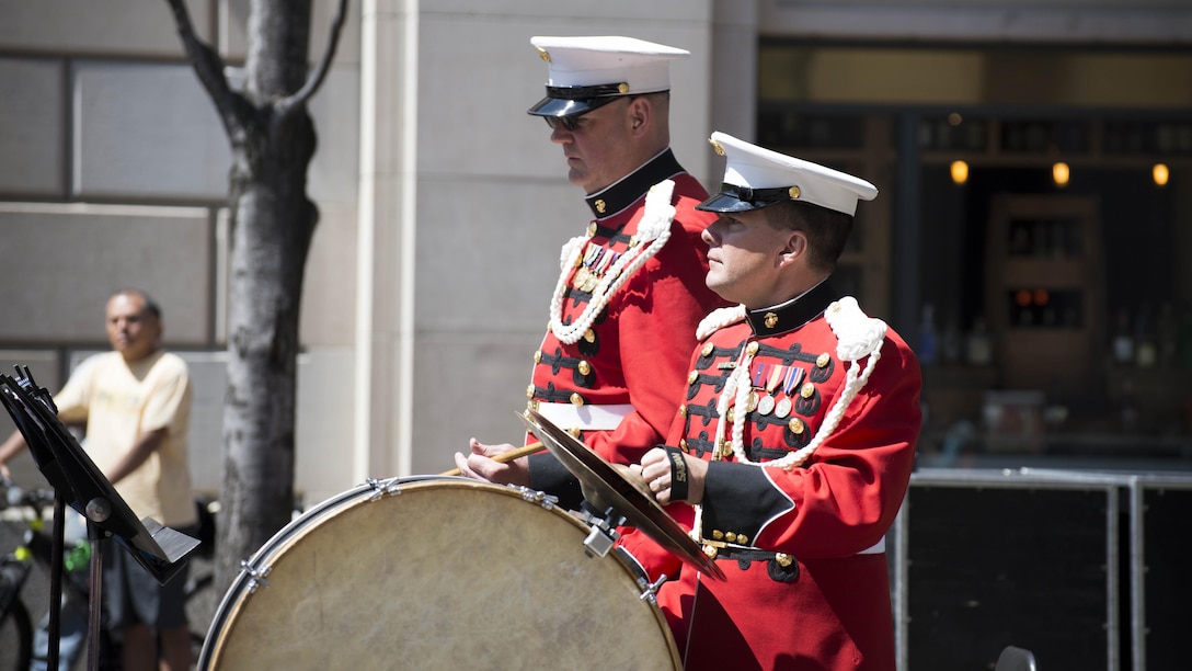 Members of The President’s Own U.S. Marine Corps Band play “Anchor’s Away” during the 25th annual Blessing of the Fleets ceremony at U.S. Navy Memorial in Washington, April 16. The Blessing of the Fleets ritual is intended to safeguard crews and ships from the danger of the seas through a blessing given by a clergyman at the water’s edge. During the ceremony, Sailors from the U.S. Navy’s Ceremonial Guard and Marines from the U.S. Marine Barracks, Washington, DC, proceeded across the outdoor plaza’s “Granite Sea” and poured water from the Seven Seas and Great Lakes into the surrounding fountains, “charging” them to life and welcoming the spring season. 