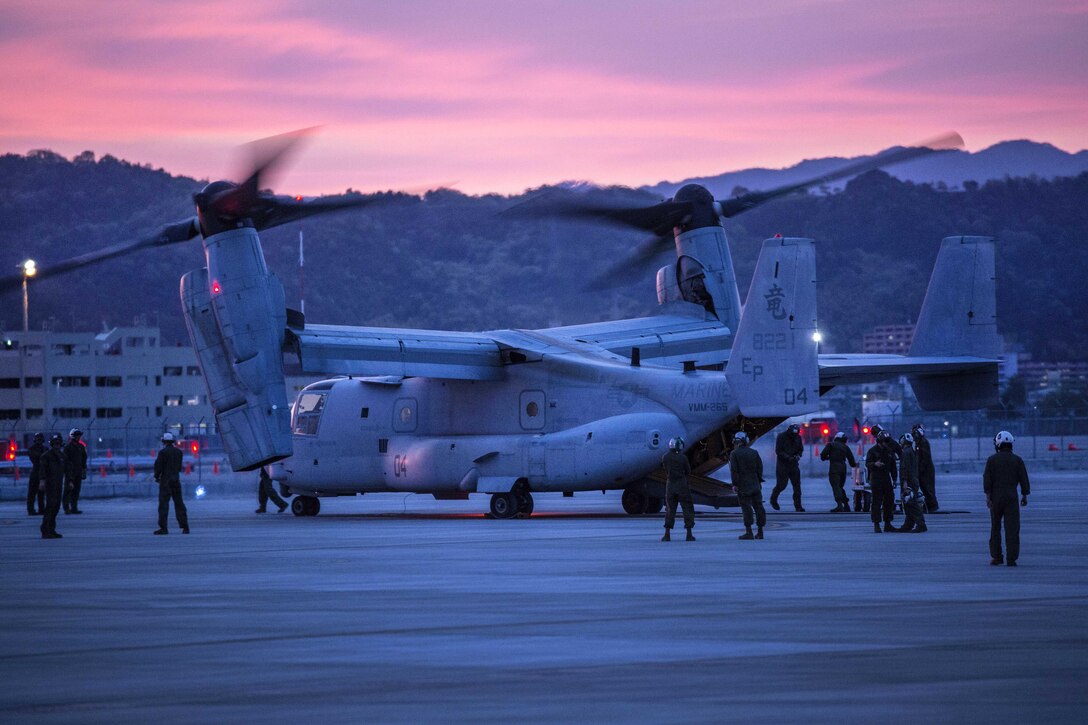 Marines exit and secure an MV-22 Osprey aircraft at Marine Corps Air Station Iwakuni, Japan, April 18, 2016. Marine Corps photo by Cpl. Nathan Wicks