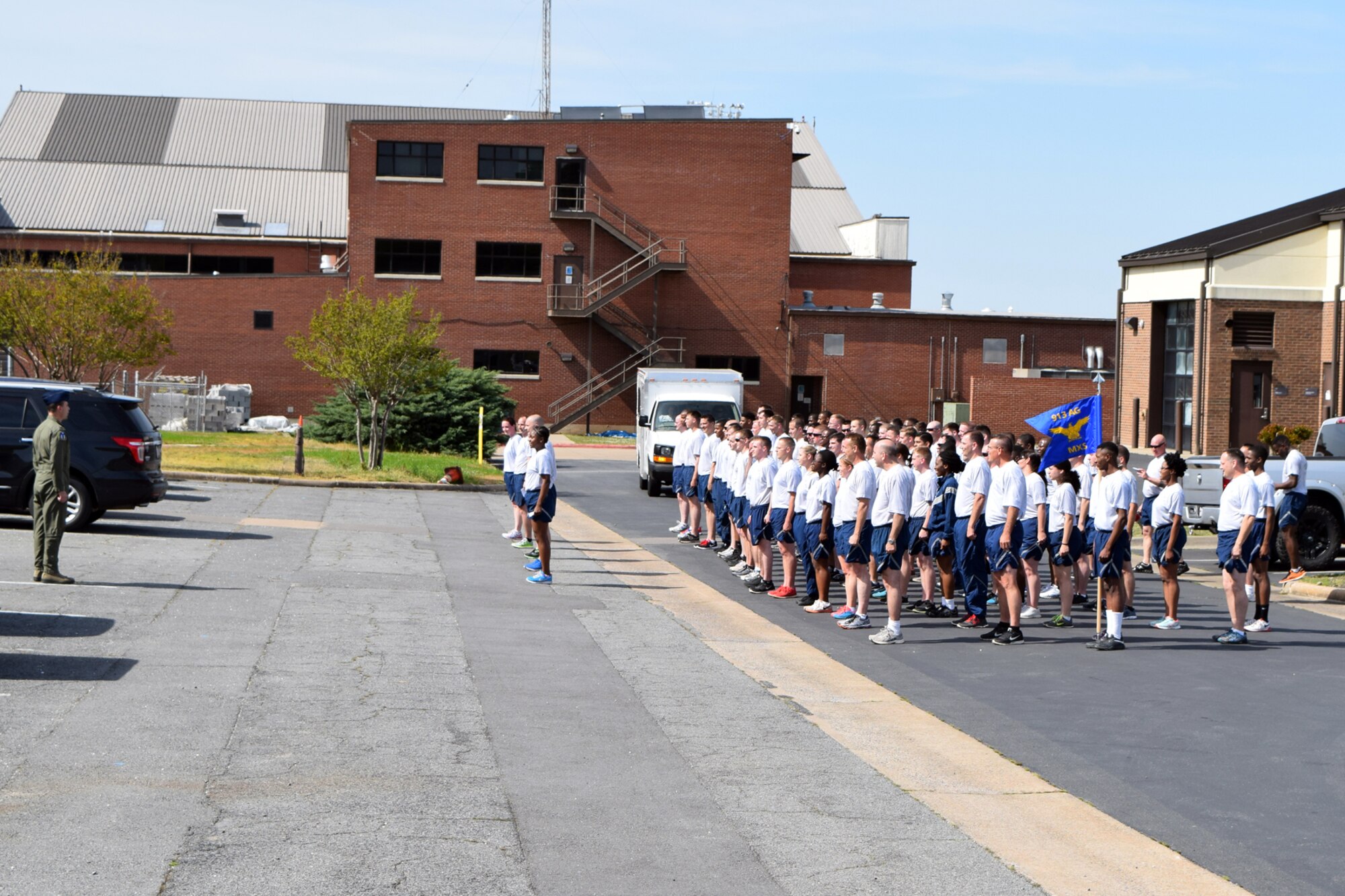 (Left) U.S. Air Force Reserve Col. Craig Drescher, commander, 913th Airlift Group, speaks to a 913th Maintenance Squadron formation at a ‘Fun Run’ during the Unit Assembly Training weekend at Little Rock Air Force Base, Ark., Apr. 9, 2016. The 1.5 mile run was conducted to build morale and esprit de corps within the squadron. (Courtesy photo)