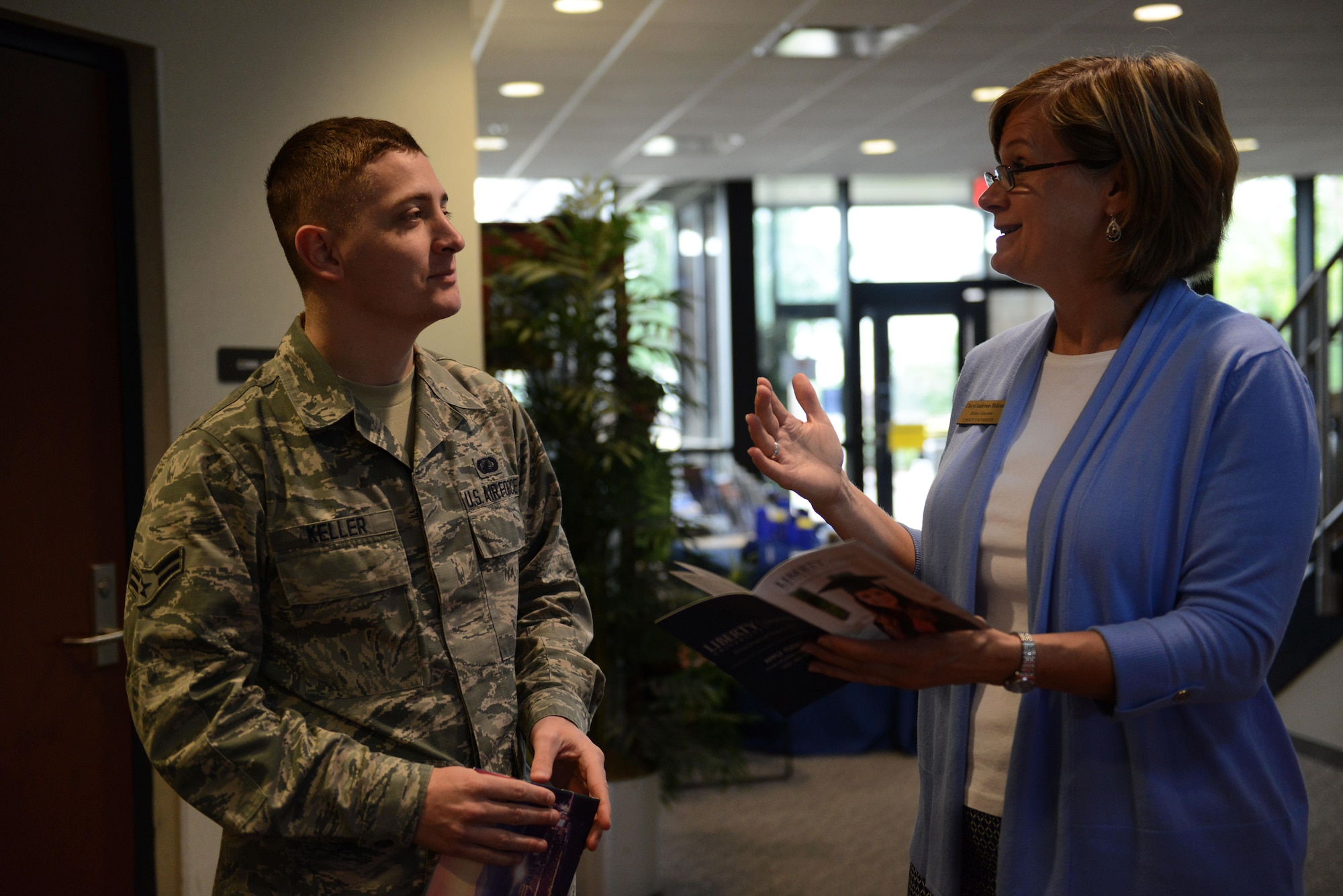 U.S. Air Force Airman 1st Class Jordan Keller, 20th Comptroller Squadron financial management accountant, speaks with Cheryl Anderson-McKenna, Liberty University’s military education coordinator, during a Spring Education Fair at Shaw Air Force Base, S.C., April 13, 2016. The education fair provided an opportunity for service members and dependents to speak face-to-face with representatives from 16 colleges and universities. (U.S. Air Force photo by Airman 1st Class Destinee Dougherty)