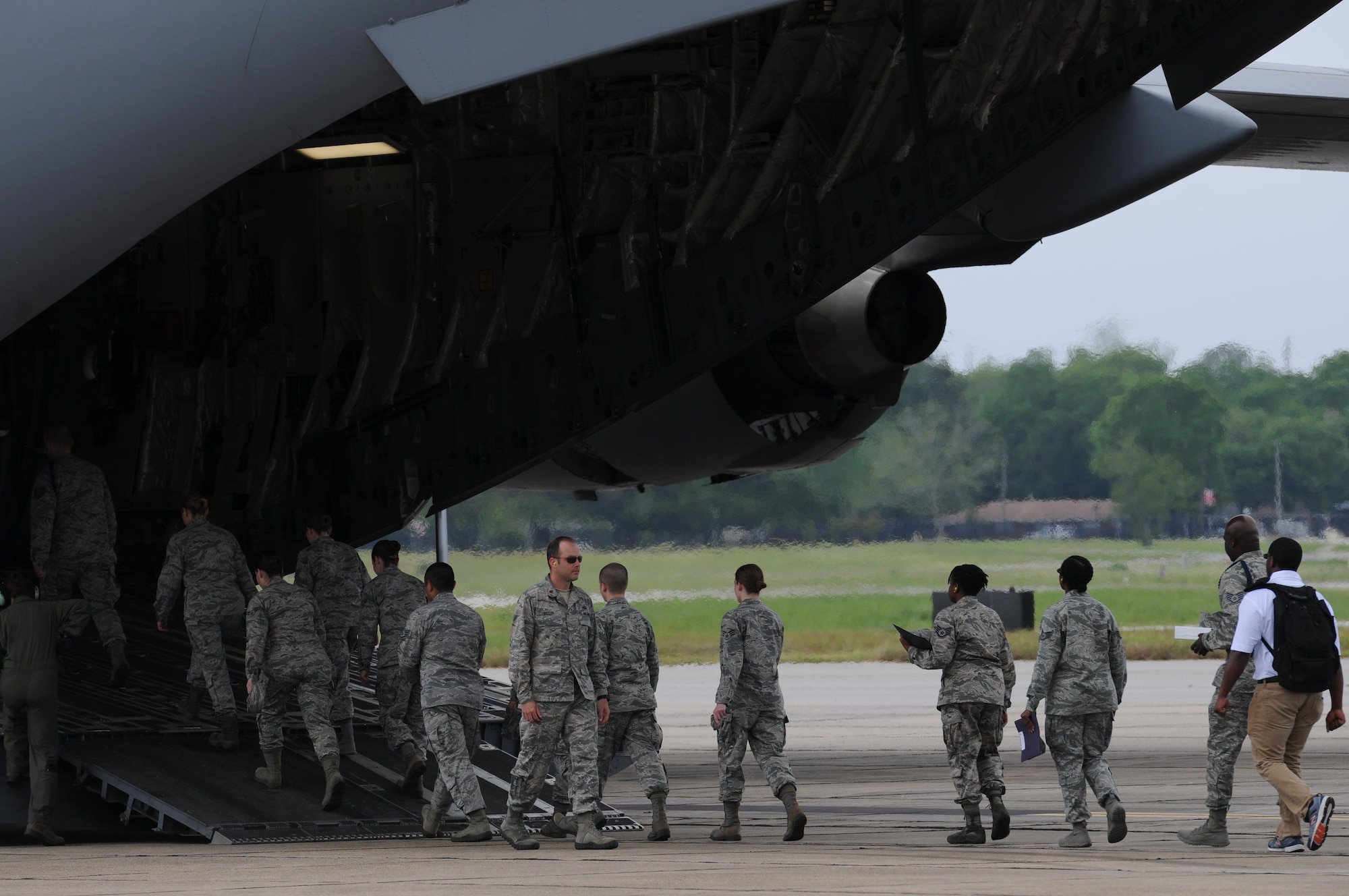 Air Force ROTC cadets board a C-17 Globemaster III for an incentive flight during Pathways to Blue April 15, 2016, Keesler Air Force Base, Miss. Pathways to Blue, a diversity outreach event hosted by 2nd Air Force, the 81st Training Wing and the 403rd Wing, included more than 180 cadets from Air Force ROTC detachments from various colleges and universities. Cadets received hands-on briefings on technical and flying operations and an orientation flight in support of the Air Force's Diversity Strategic Roadmap program. (U.S. Air Force photo by Kemberly Groue)