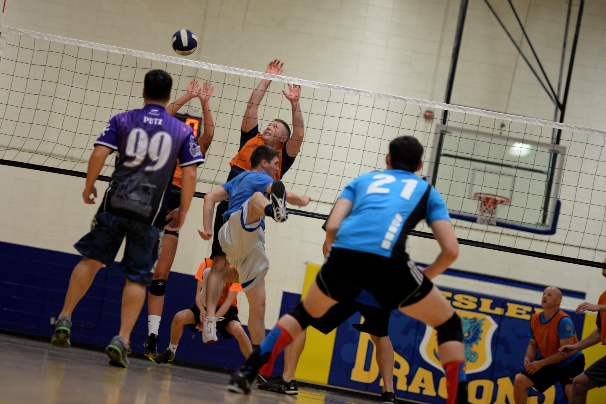 Members of the 81st Training Support Squadron and 85th Engineering Installation Squadron play in the intramural volleyball championship game at the Blake Fitness Center April 14, 2016, Keesler Air Force Base, Miss. The 85th EIS defeated the 81st TRSS, 2-1, to win the intramural volleyball championship. (U.S. Air Force photo by Airman 1st Class Travis Beihl)