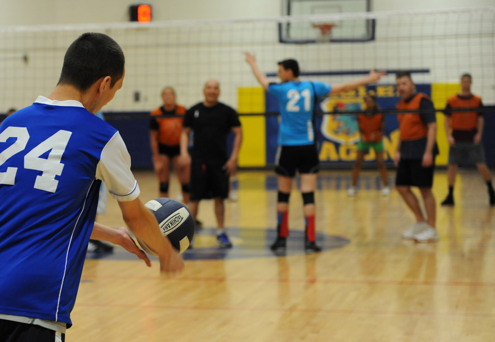 Staff Sgt. Mark Detwiler, 85th Engineering Installation Squadron ground radar maintenance technician, serves the ball during the intramural volleyball championship game at the Blake Fitness Center April 14, 2016, Keesler Air Force Base, Miss. The 85th EIS defeated the 81st Training Support Squadron, 2-1, to win the intramural volleyball championship. (U.S. Air Force photo by Kemberly Groue)