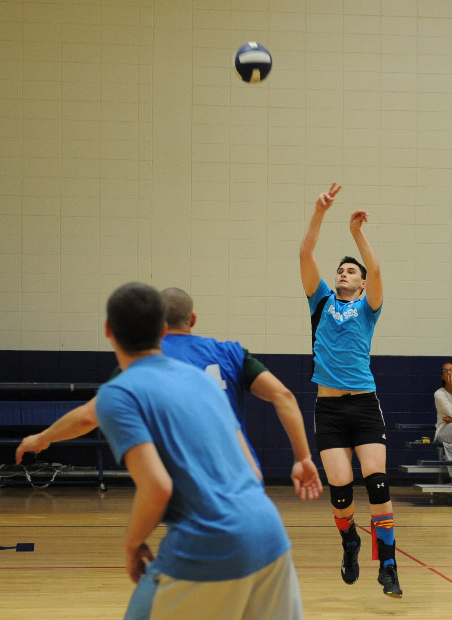 Senior Airman Drake Griffin, 85th Engineering Installation Squadron cable and antenna systems technician, hits the ball during the intramural volleyball championship game at the Blake Fitness Center April 14, 2016, Keesler Air Force Base, Miss. The 85th EIS defeated the 81st Training Support squadron, 2-1, to win the intramural volleyball championship. (U.S. Air Force photo by Kemberly Groue)