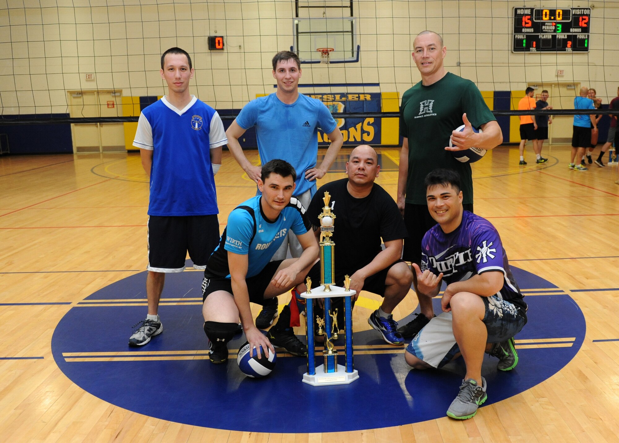Members of the 85th Engineering Installation Squadron intramural volleyball team poses for a photo after the intramural volleyball championship game at the Blake Fitness Center April 14, 2016, Keesler Air Force Base, Miss. The 85th EIS defeated the 81st Training Support Squadron, 2-1, to win the intramural volleyball championship. (U.S. Air Force photo by Kemberly Groue)