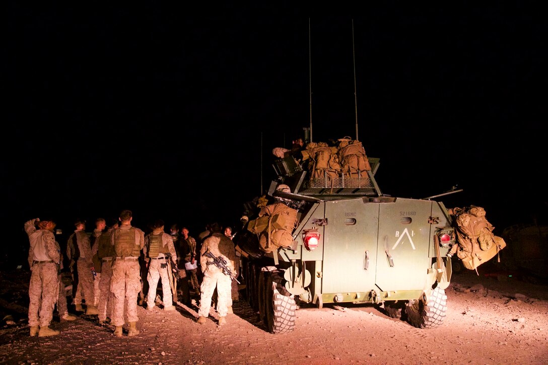DJIBOUTI, Africa (Apr. 14, 2016)- U.S. Marines with the 13th Marine Expeditionary Unit receive a convoy brief before departing to a live fire range in Djibouti, Africa, Apr. 14, 2016. The 13th MEU is conducting sustainment training to maintain proficiency and combat readiness as part of the Boxer Amphibious Ready Group team on a scheduled deployment to the Western Pacific area of operations. (U.S. Marine Corps photo by 1stLt Francheska Soto/ RELEASED)
