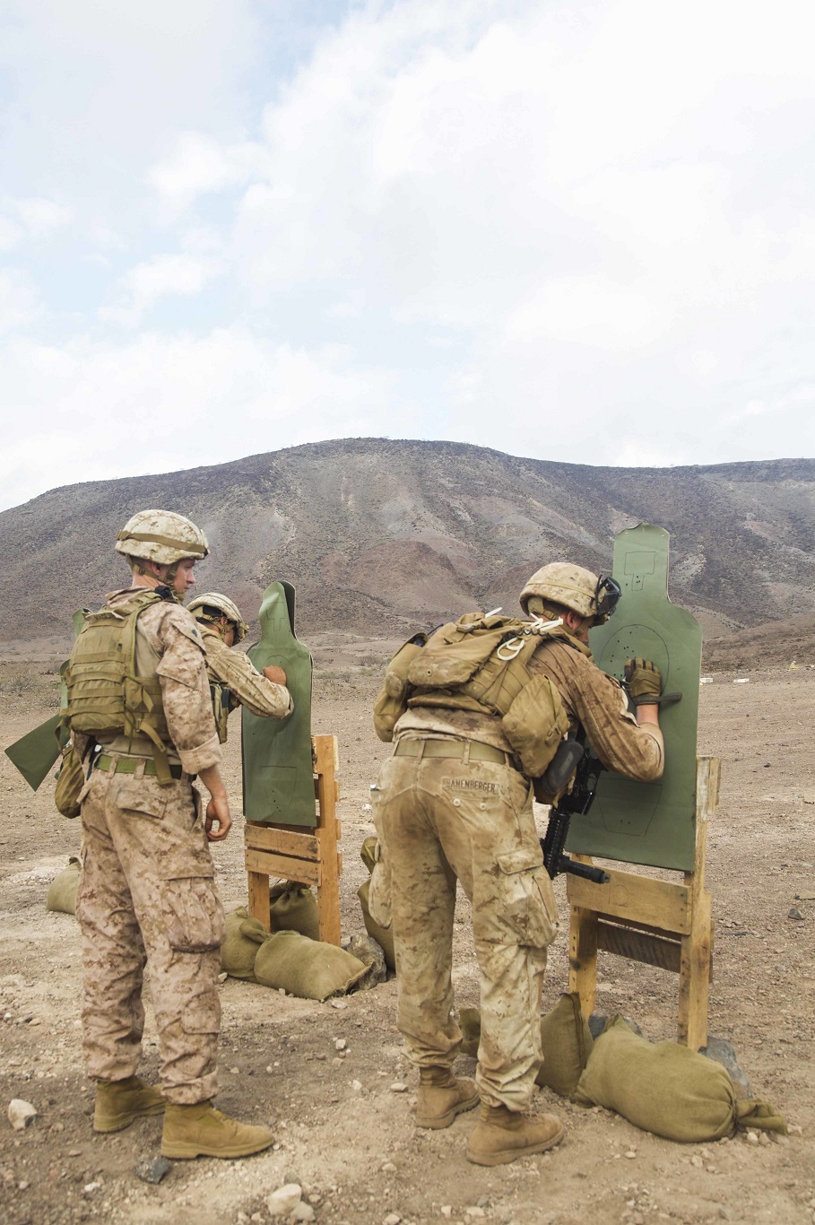DJIBOUTI, Africa (Apr. 14, 2016)- U.S. Marines with the 13th Marine Expeditionary Unit count their shots on target after a live fire shoot in Djibouti, Africa, Apr. 14, 2016. The 13th MEU is conducting sustainment training to maintain proficiency and combat readiness as part of the Boxer Amphibious Ready Group team on a scheduled deployment to the Western Pacific area of operations. (U.S. Marine Corps photo by 1stLt Francheska Soto/ RELEASED)