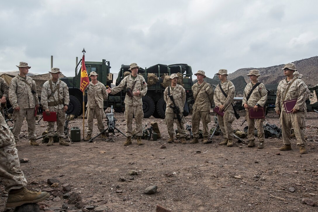 U.S. Marines with Battery B, Battalion Landing Team 2nd Battalion, 1st Marine Regiment, 13th Marine Expeditionary Unit make time to award the Marines who've earned it in Djibouti, Africa, Apr. 11, 2016.(U.S. Marine Corps photo by Cpl. Alvin Pujols/RELEASED)