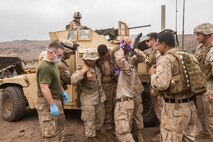 U.S. Marines and Sailors with the 13th Marine Expedtionary Unit conduct a casualty evacuation drill to maintain proficiency in Djibouti, Africa, Apr. 16, 2016. The 13th MEU is conducting sustainment training to maintain proficiency and combat readiness as part of the Boxer Amphibious Ready Group on a scheduled deployment to the Western Pacific area of responsibility. (U.S. Marine Corps photo by Cpl. Alvin Pujols/RELEASED)