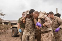 U.S. Marines and Sailors with the 13th Marine Expedtionary Unit conduct a casualty evacuation drill to maintain proficiency in Djibouti, Africa, Apr. 16, 2016. The 13th MEU is conducting sustainment training to maintain proficiency and combat readiness as part of the Boxer Amphibious Ready Group on a scheduled deployment to the Western Pacific area of responsibility. (U.S. Marine Corps photo by Cpl. Alvin Pujols/RELEASED)