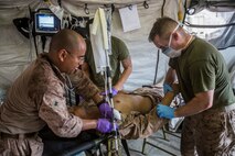 U.S. Marines and Sailors with the 13th Marine Expedtionary Unit conduct a casualty evacuation drill to maintain proficiency in Djibouti, Africa, Apr. 16, 2016. The 13th MEU is conducting sustainment training to maintain proficiency and combat readiness as part of the Boxer Amphibious Ready Group on a scheduled deployment to the Western Pacific area of responsibility. (U.S. Marine Corps photo by Cpl. Alvin Pujols/RELEASED)