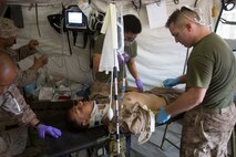 U.S. Marines and Sailors with the 13th Marine Expedtionary Unit conduct a casualty evacuation drill to maintain proficiency in Djibouti, Africa, Apr. 16, 2016. The 13th MEU is conducting sustainment training to maintain proficiency and combat readiness as part of the Boxer Amphibious Ready Group on a scheduled deployment to the Western Pacific area of responsibility. (U.S. Marine Corps photo by Cpl. Alvin Pujols/RELEASED)