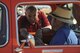 U.S. Air Force Col. Stephen Renner, 355th Fighter Wing vice commander, congratulates Harold Ashton, one of the winners of the car show during the annual DM50 Picnic, at Davis-Monthan Air Force Base, Ariz., April 16, 2016. The car show was one of many attractions at the picnic including pony and train rides, 309th Aerospace Maintenance and Regeneration Group tours, face painting and bouncy castles. (U.S. Air Force photo by Airman 1st Class Mya M. Crosby/Released)