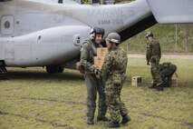 Marines with Marine Medium Tiltrotor Squadron (VMM) 265 (Reinforced), 31st Marine Expeditionary Unit, assists the Government of Japan in supporting those affected by recent earthquakes in Kumamoto, Japan, April 18, 2016. VMM-265 picked up supplies from Japan Ground Self-Defense Force Camp Takayubaru and delivered them to Hakusui Sports Park in the Kumamoto Prefecture. The long-standing relationship between Japan and the U.S. allows U.S. military forces in Japan to provide rapid, integrated support to the Japan Self-Defense Forces and civil relief efforts. (U.S. Marine Corps photos by Cpl. Nathan Wicks/Released)