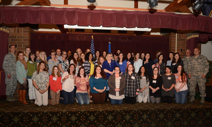 Members of the Team McChord Key Spouses pose for a photo during the Key Spouse Luncheon April 13, 2016 at Joint Base Lewis-McChord, Wash. More than 50 U.S. Air Force spouses received special recognition for their contributions to the Team McChord Key Spouse Program during the 2016 Key Spouse Appreciation Luncheon. (U.S. Air Force photo/Senior Airman Divine Cox) 