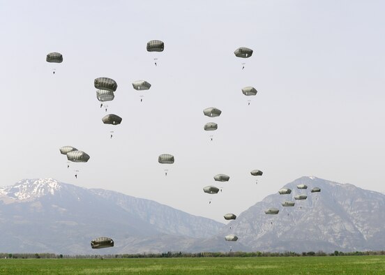U.S. Army Soldiers and NATO service members participate in a jump exchange prior to Saber Junction 16, April 5, 2016, at Aviano Air Base, Italy. The exercise involved the 173rd Airborne Brigade and 16 allied and European nations conducting land operations in a joint, combined environment and to promote interoperability with participating nations. (U.S. Air Force photo by Airman 1st Class Cory W. Bush/Released)
