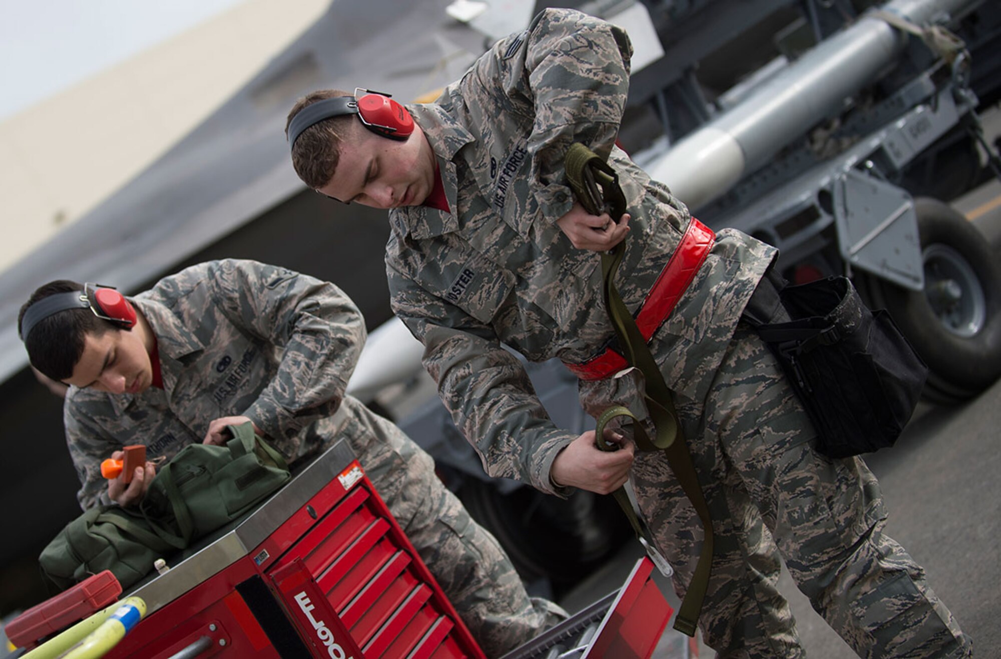 Airman 1st Class Kendal Henthorn and Senior Airman Scott Foster, conduct a tool inventory upon completion of the loading task during a load crew competition at Joint Base Elmendorf-Richardson, Alaska, April 15, 2016. Henthorn and Foster are both assigned to the 3rd Aircraft Maintenance Squadron. (U.S. Air Force photo by Staff Sgt. Sheila deVera)