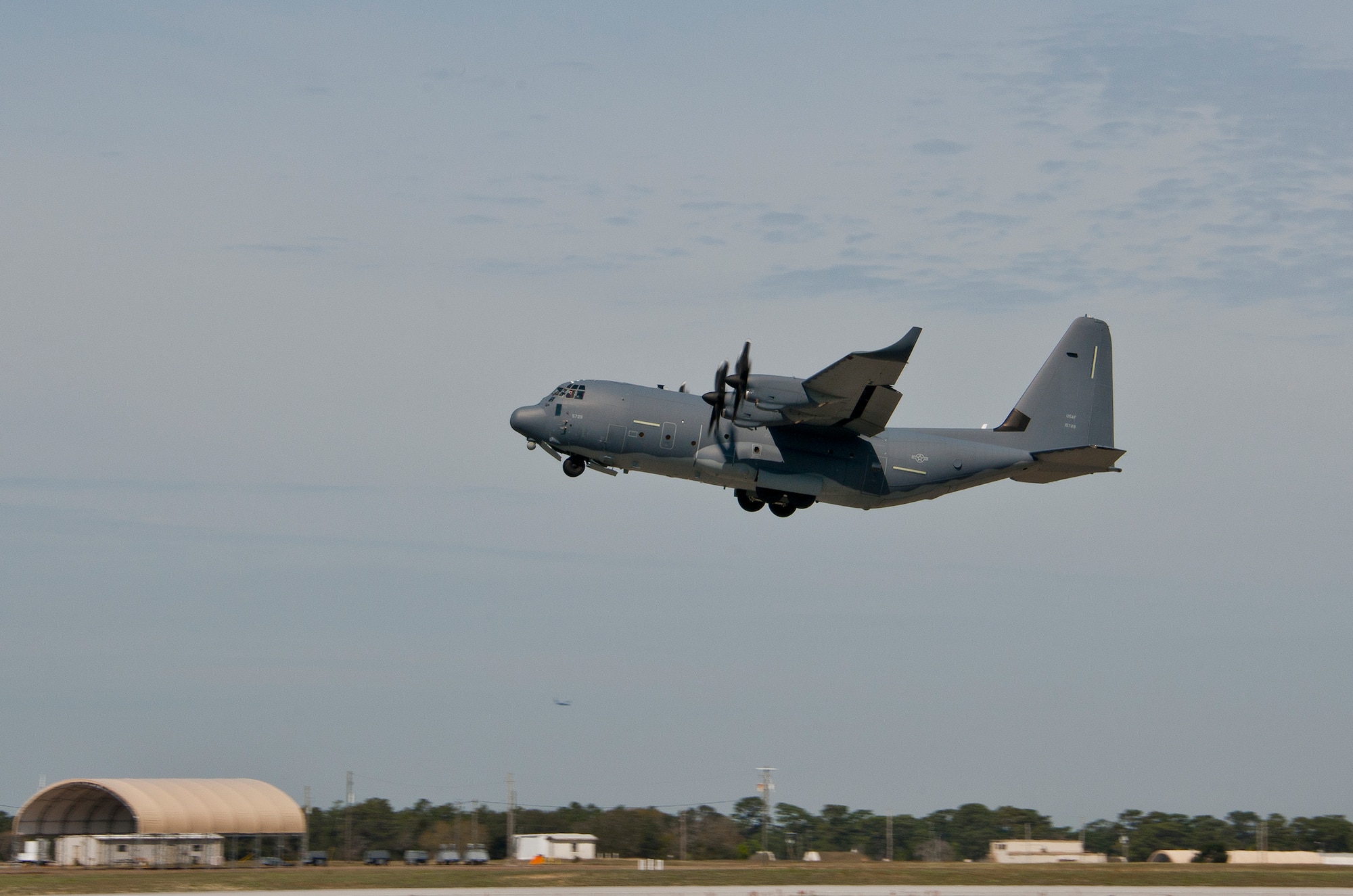 A modified MC-130J lifts off from Eglin Air Force Base, Fla., for a test mission. The aircraft was fitted with vertical fins on each wing, called winglets.  The 413th Flight Test Squadron aircrew and engineers tested the modified aircraft over eight flights.  The goal of the tests was to collect data on possible fuel efficiency improvements and performance with the winglets and lift distribution control system installed.  (U.S. Air Force photo/Samuel King Jr.)