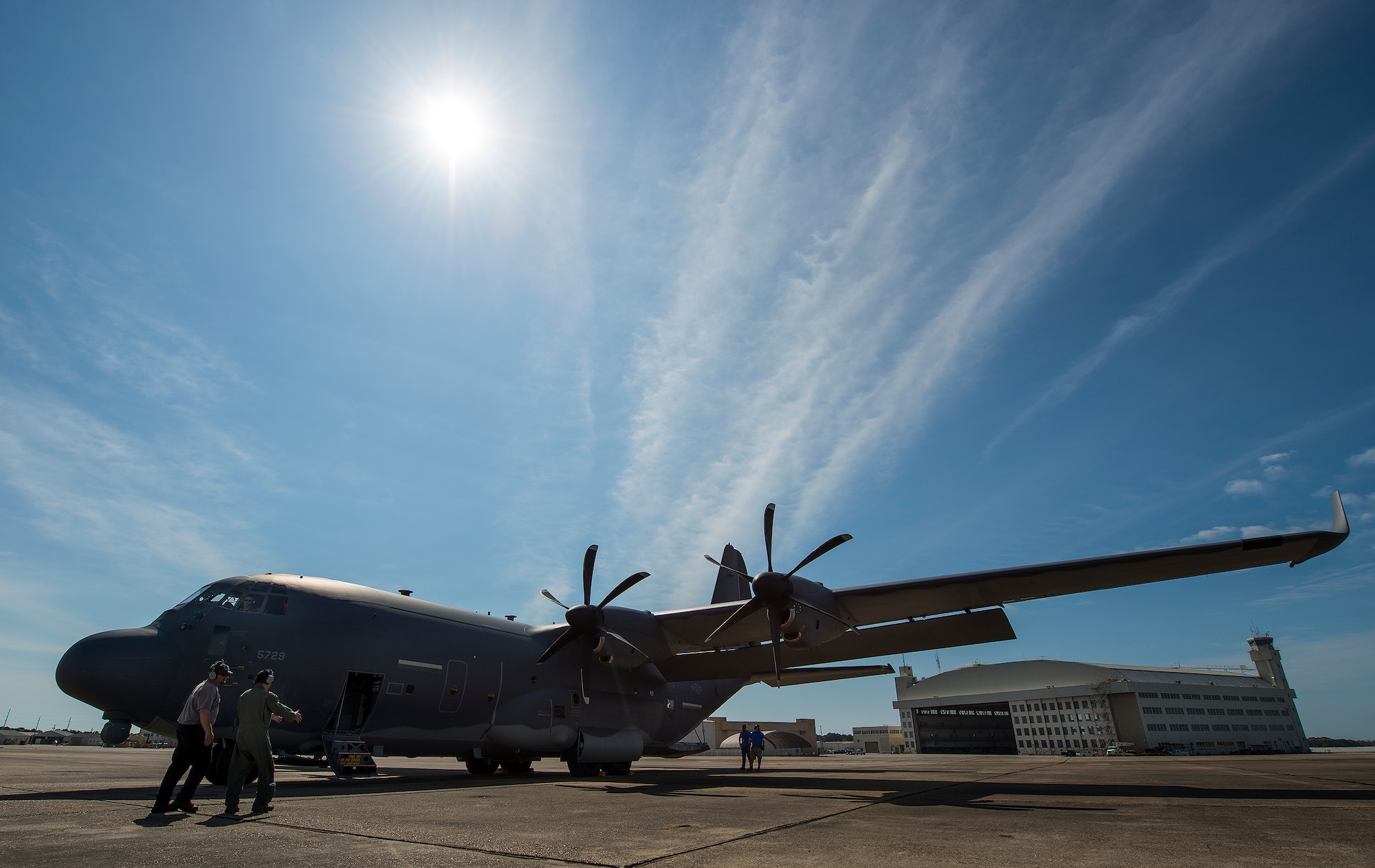 A maintainer and loadmaster complete preflight checks on a modified MC-130J prior to a mission at Eglin Air Force Base, Fla. The test aircraft was fitted with vertical fins on each wing, called winglets.  The 413th Flight Test Squadron aircrew and engineers tested the modified aircraft over eight flights.  The goal of the tests was to collect data on possible fuel efficiency improvements and performance with the winglets and lift distribution control system installed.  (U.S. Air Force photo/Samuel King Jr.)