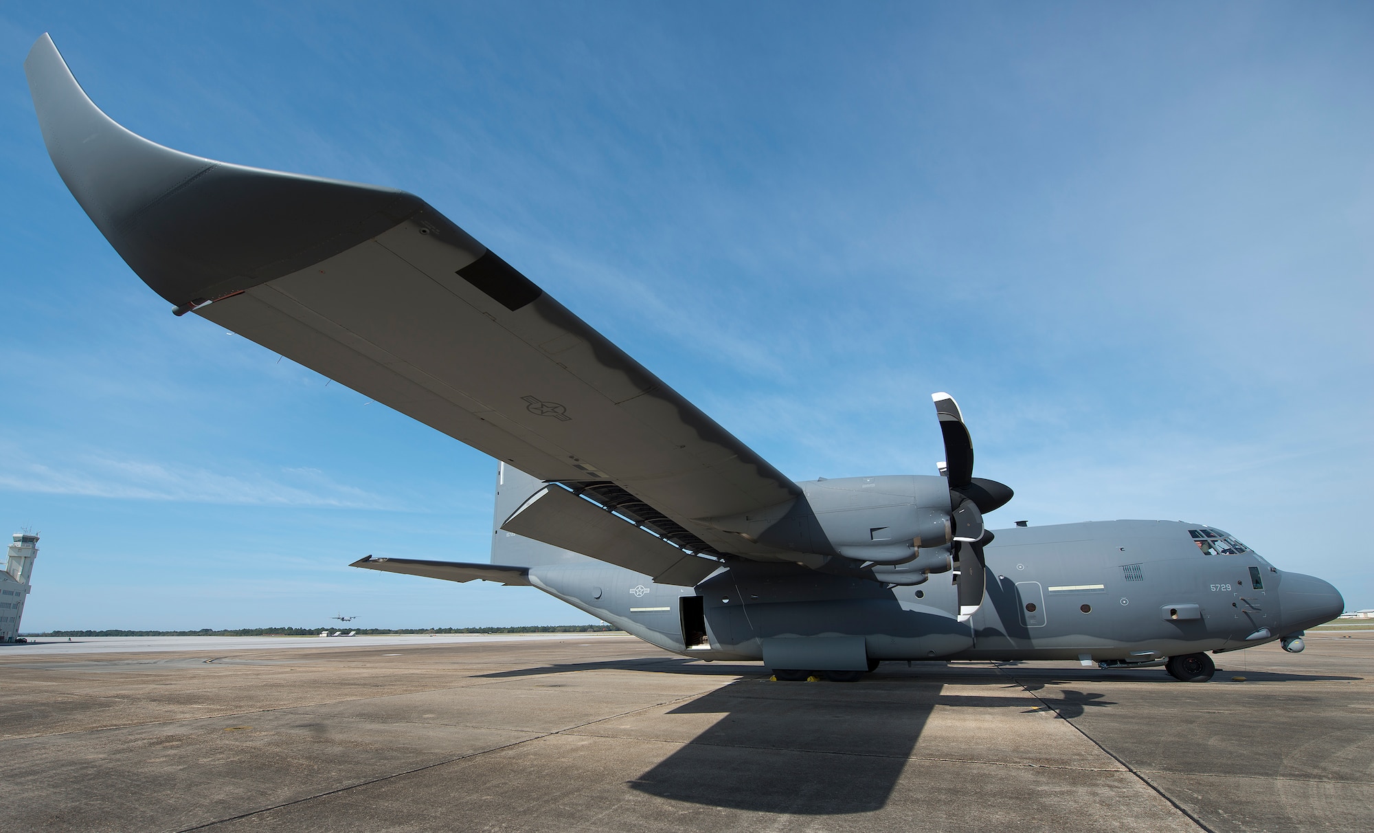 A modified MC-130J awaits its next mission at Eglin Air Force Base, Fla.  The aircraft was fitted with vertical fins on each wing, called winglets.  The 413th Flight Test Squadron aircrew and engineers tested the modified aircraft over eight flights.  The goal of the tests was to collect data on possible fuel efficiency improvements and performance with the winglets and lift distribution control system installed.  (U.S. Air Force photo/Samuel King Jr.)