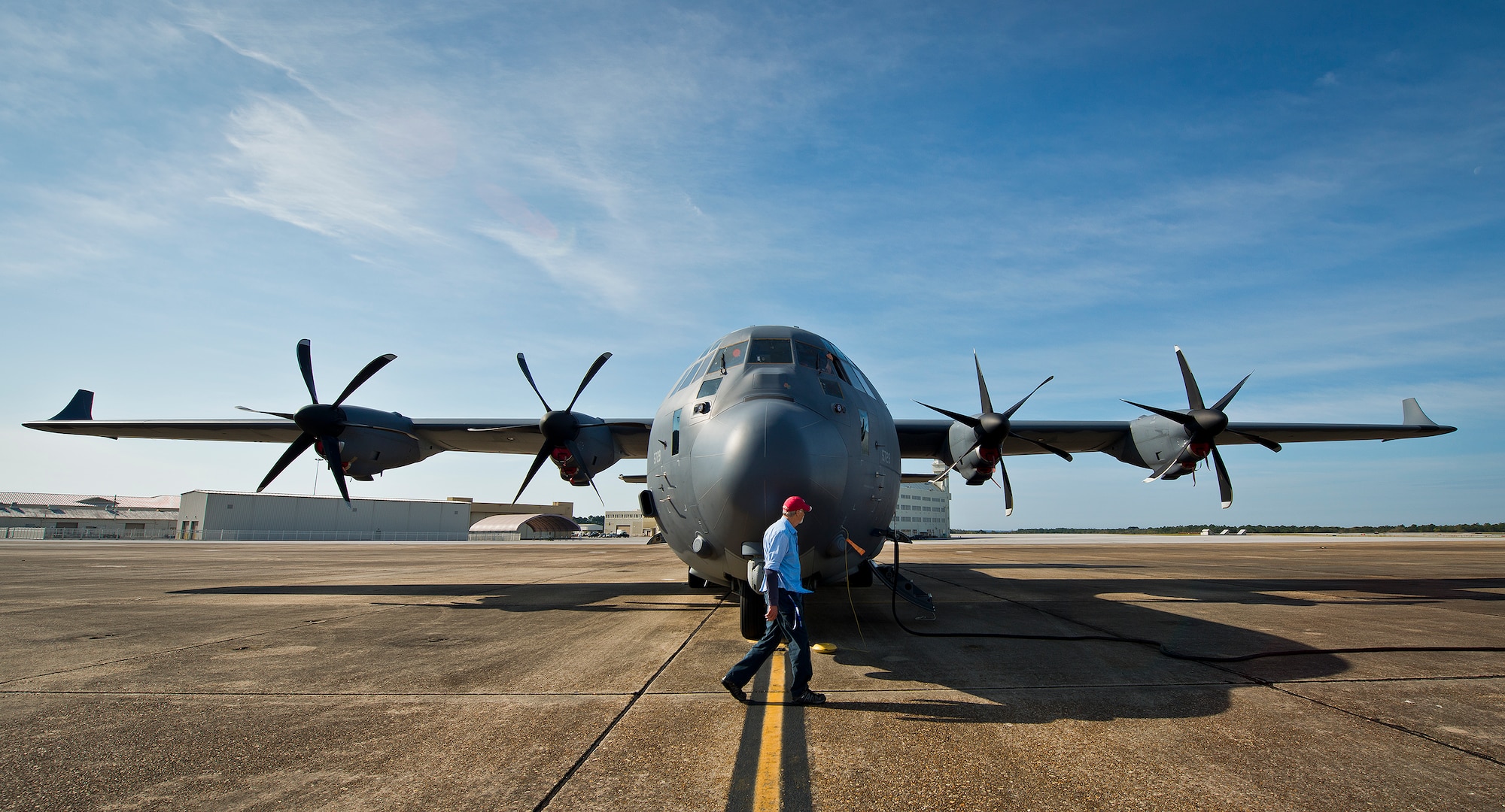 Earl Haun, a Lockheed Martin maintenance contractor with the 413th Flight Test Squadron, walks around a modified MC-130J during preflight checks at Eglin Air Force Base, Fla. The aircraft was fitted with vertical fins on each wing, called winglets.  The 413th Flight Test Squadron aircrew and engineers tested the modified aircraft over eight flights.  The goal of the tests was to collect data on possible fuel efficiency improvements and performance with the winglets and lift distribution control system installed.  (U.S. Air Force photo/Samuel King Jr.)