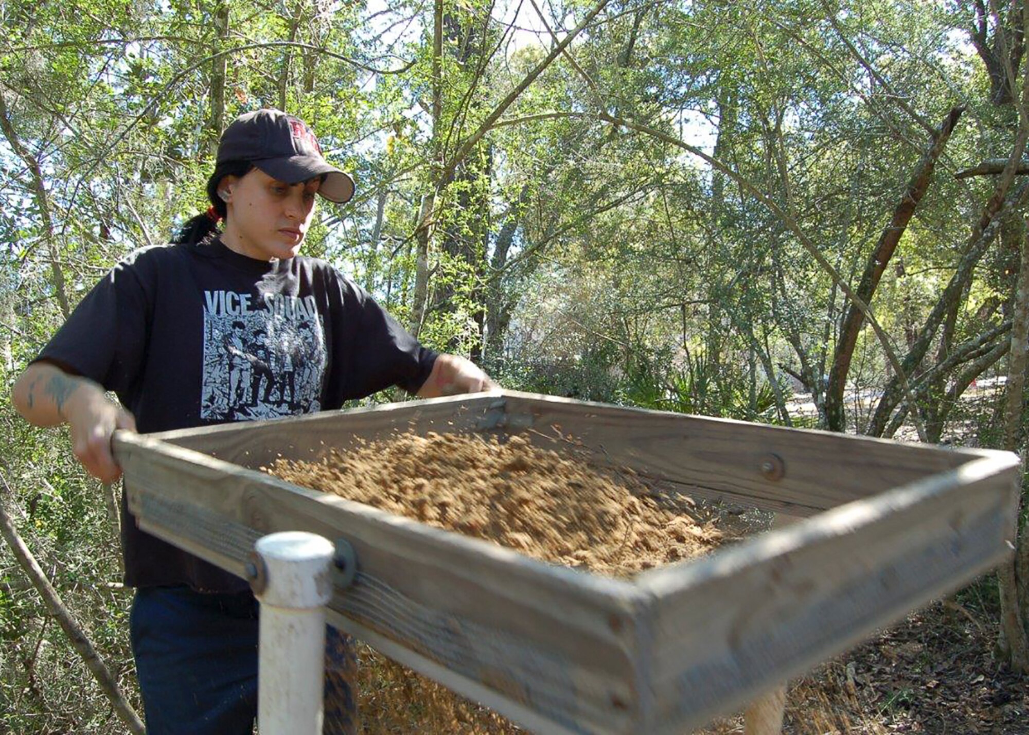 An EQ Team member conducts screening on an Eglin archaeology site.  Eglin surveyed 13,740 acres, clearing much of that land for future missions.  